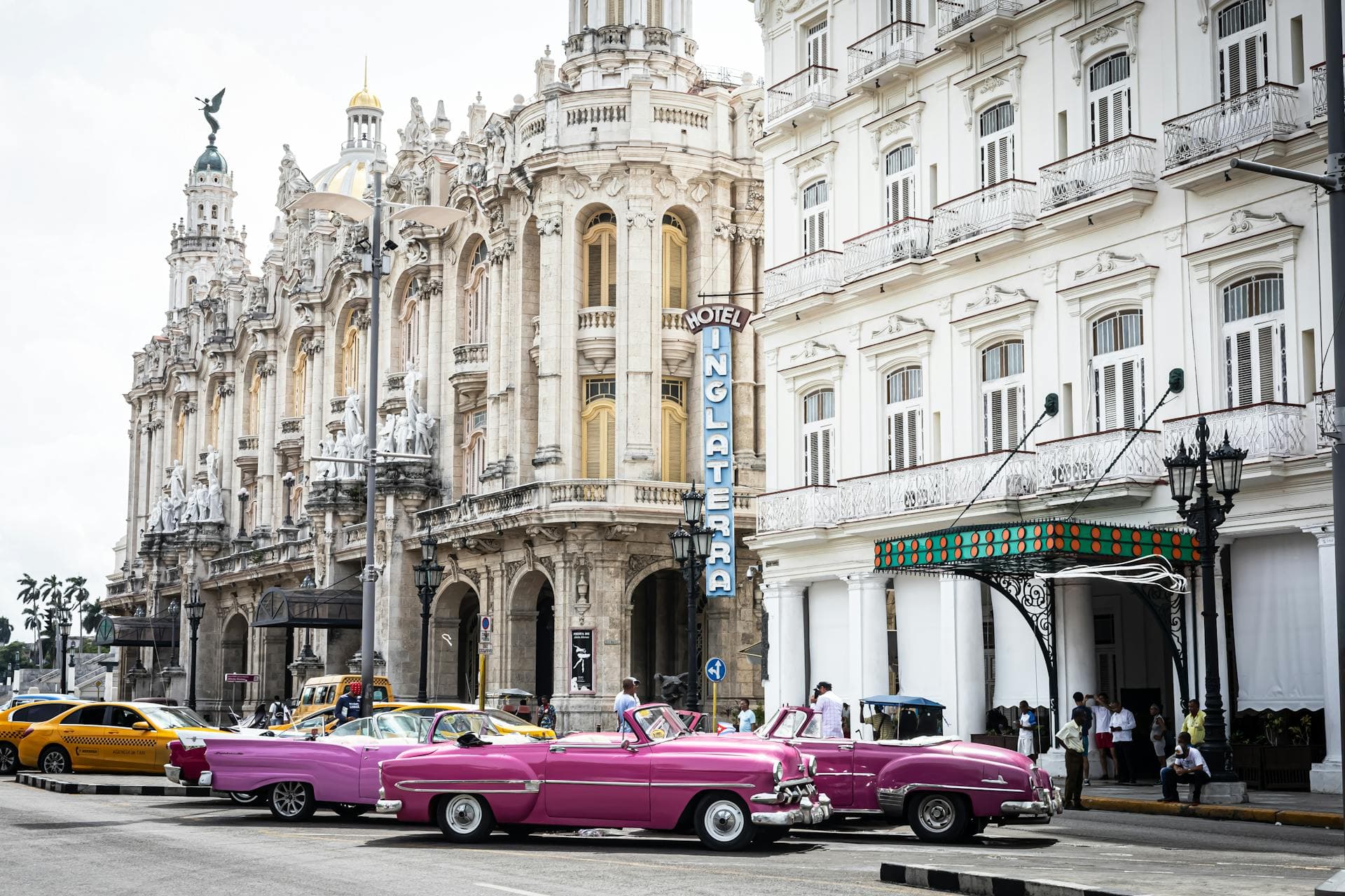 Classic American cars and colourful colonial buildings in the streets of Old Havana, Cuba
