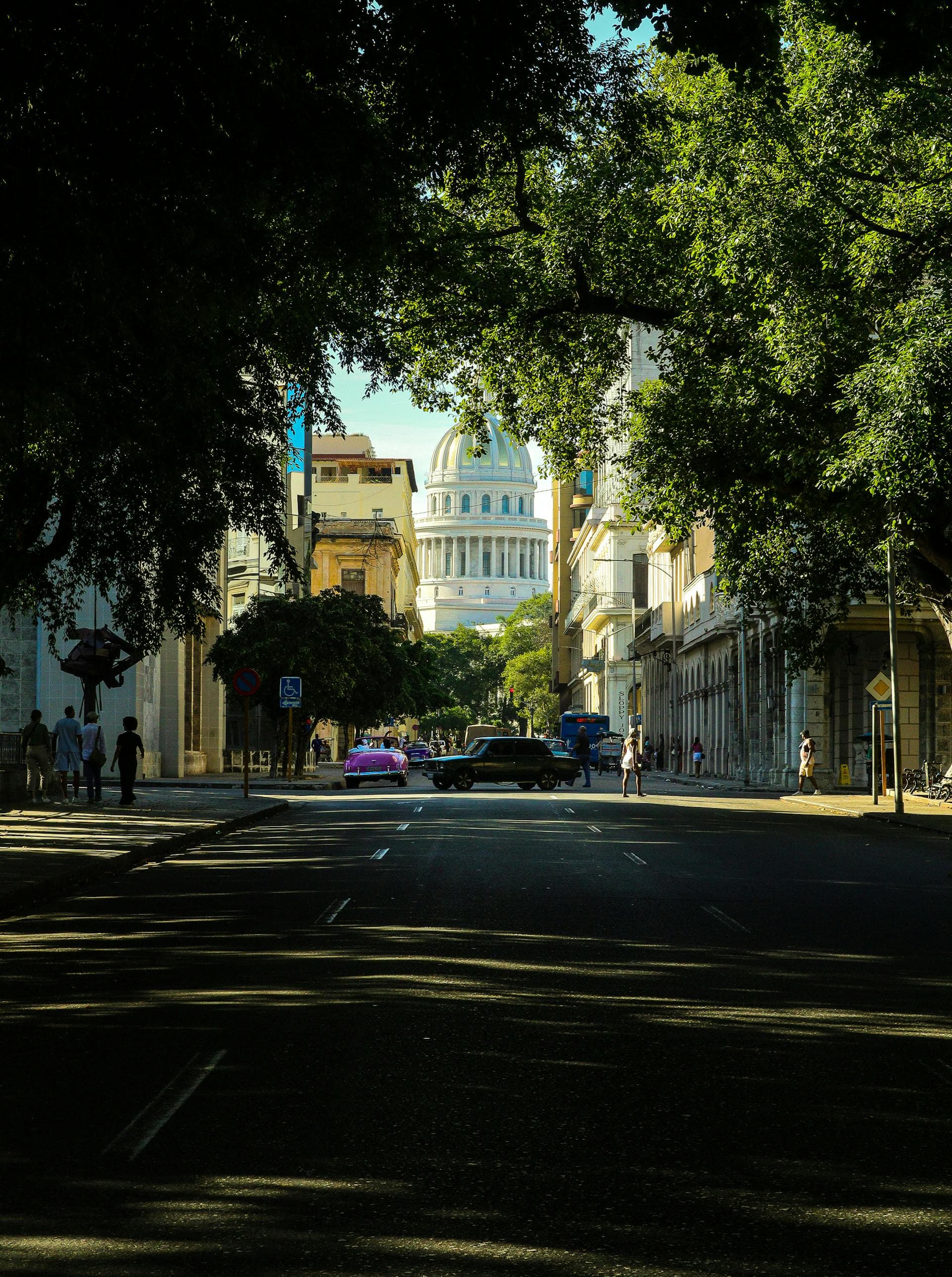 Street view of Havana with the iconic Capitol Building dome, near Hotel Iberostar Selection Parque Central