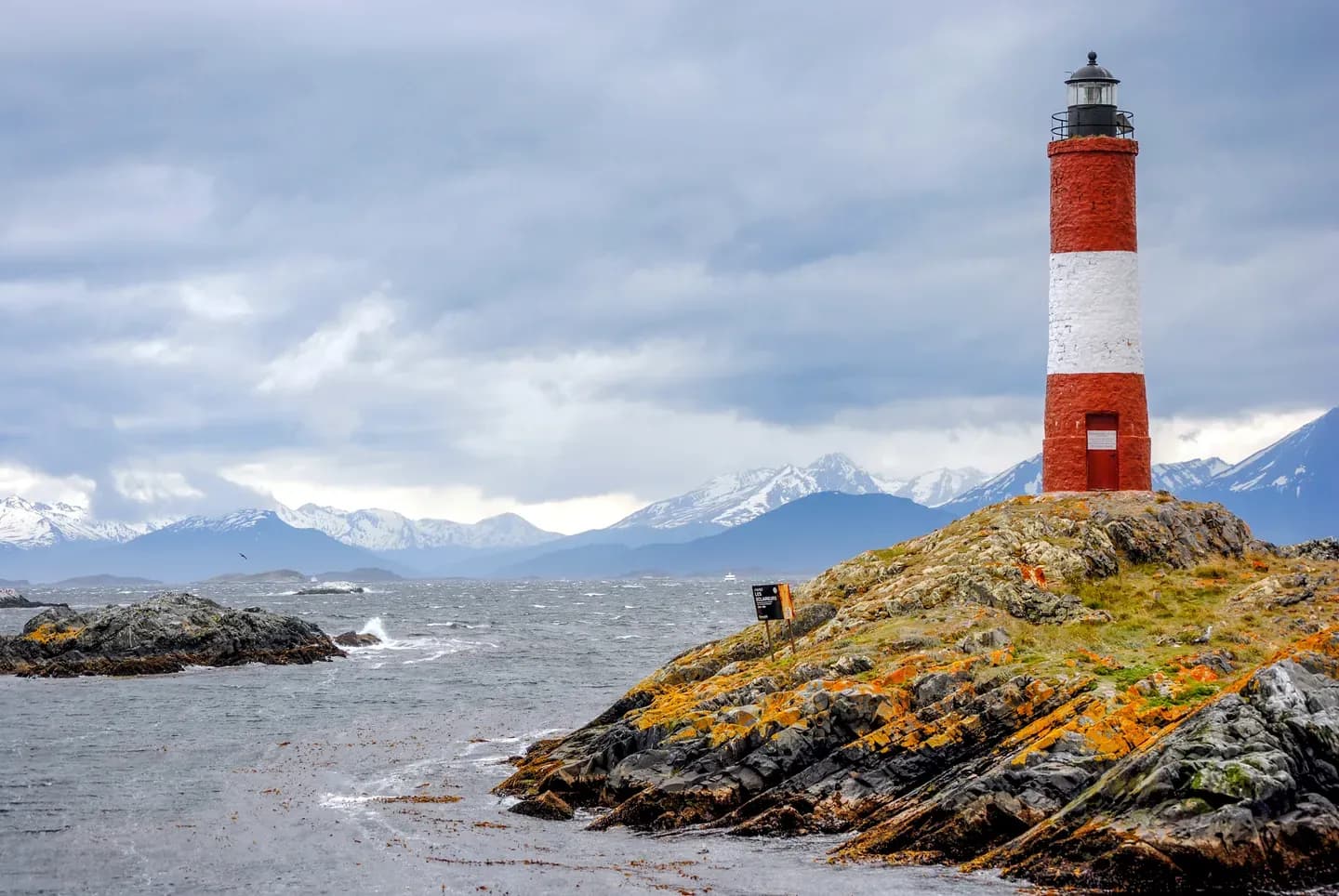 The red and white Les Eclaireurs lighthouse on its rock in the Beagle Channel, Tierra del Fuego, Argentina