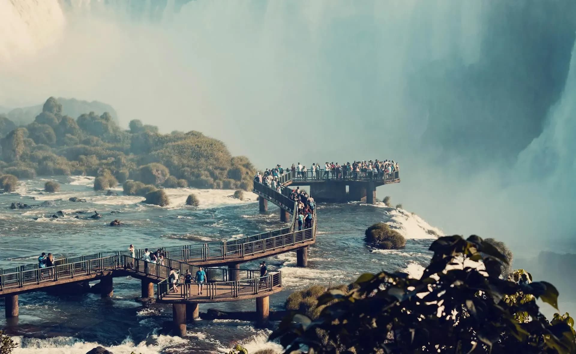 Iguazu Falls cascading through lush rainforest on the Brazil-Argentina border