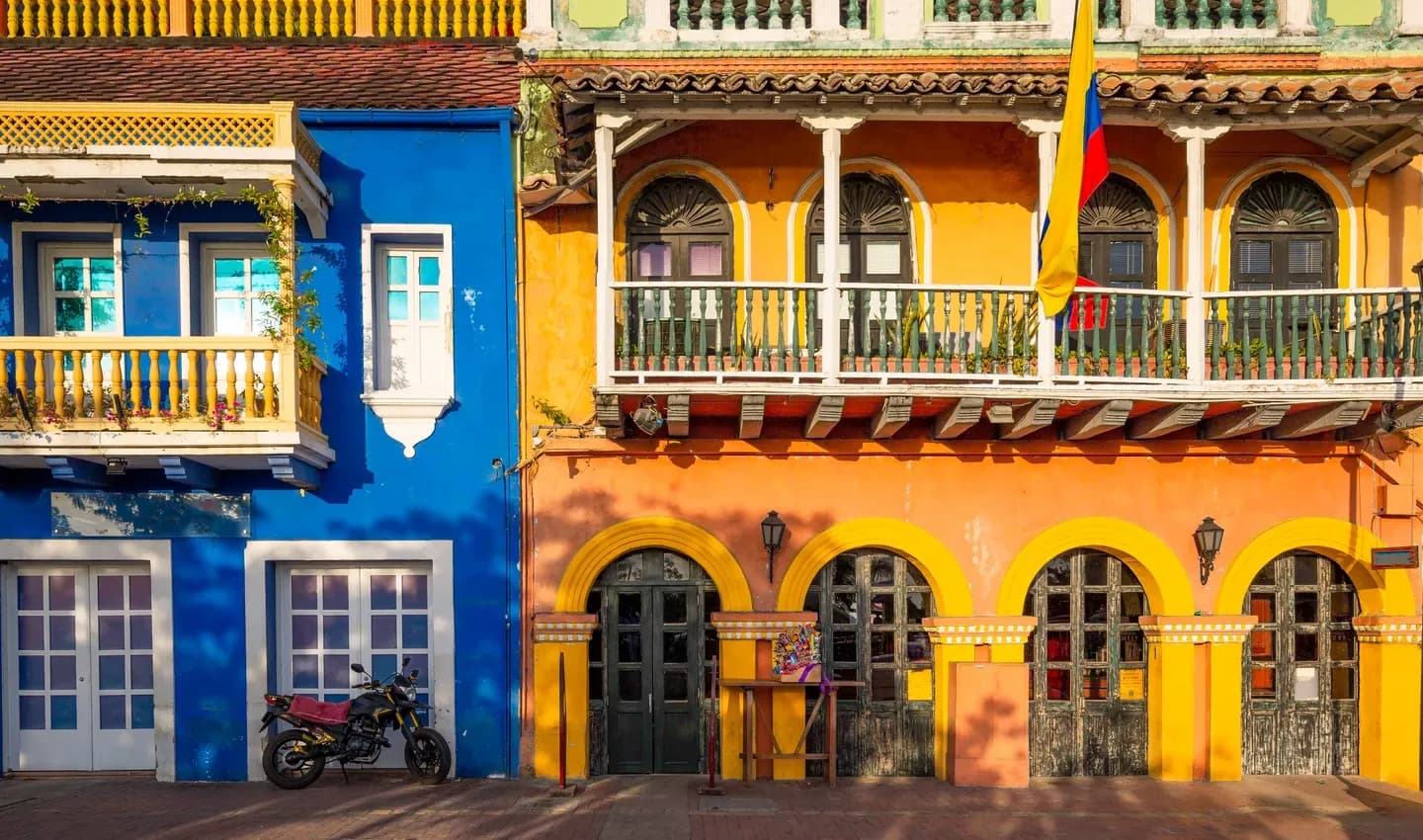 Blue and orange colonial houses with wooden balconies in Cartagena, Colombia
