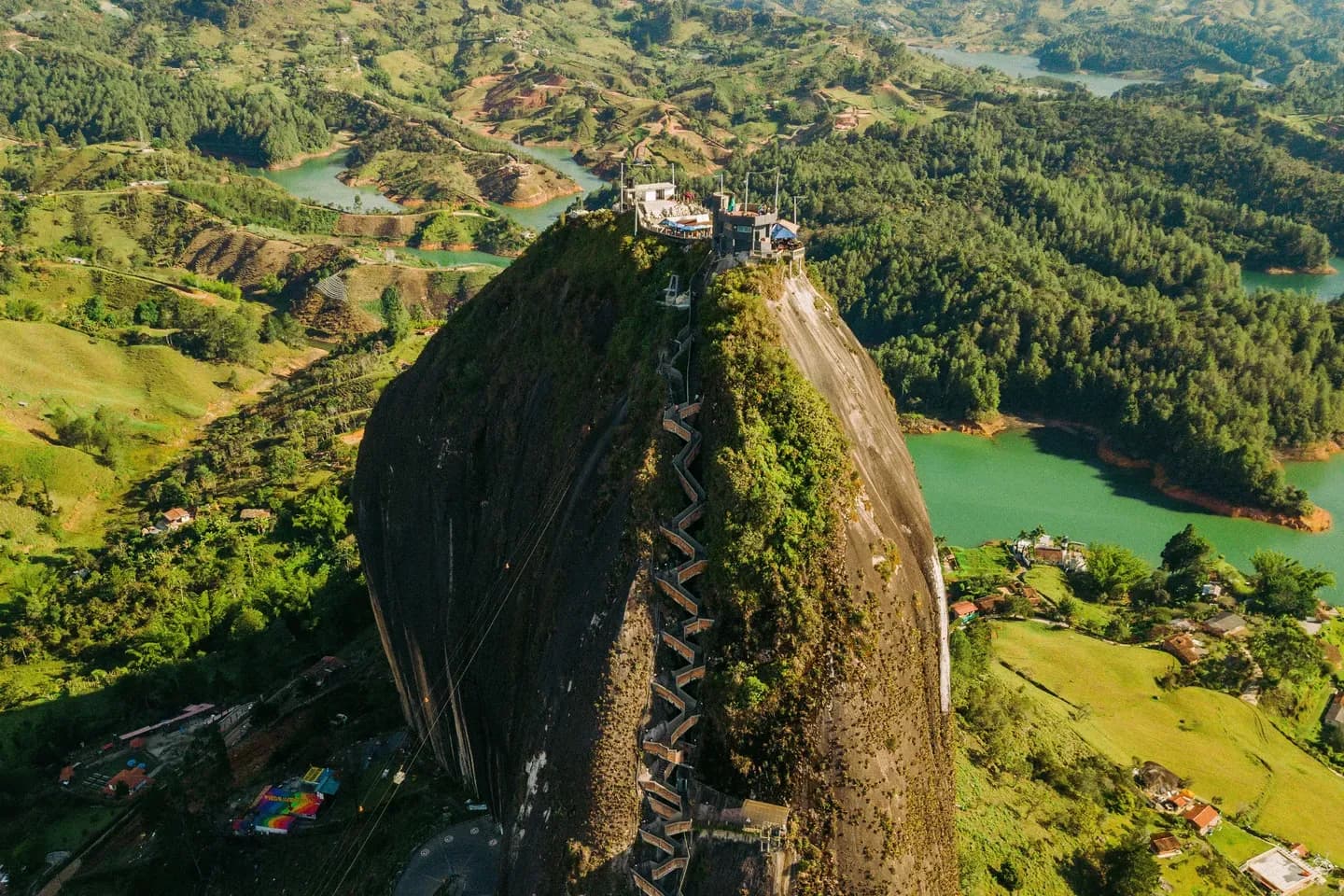 The granite rock of El Peñol rising above the lakes of Guatapé, Antioquia, Colombia, from the air