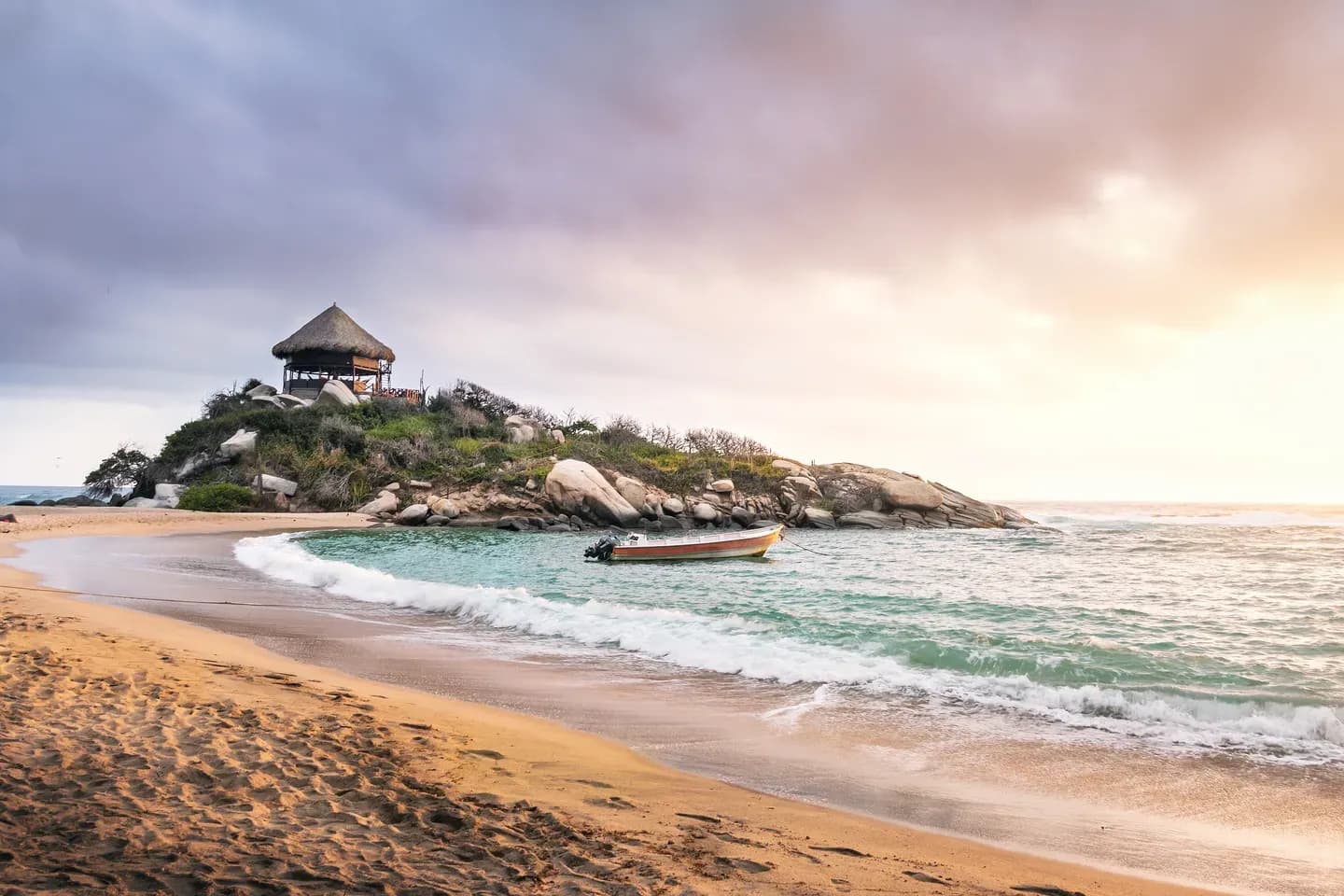 Sunrise over the beach and the rocky headland of Cabo San Juan in Tayrona National Park, Colombia