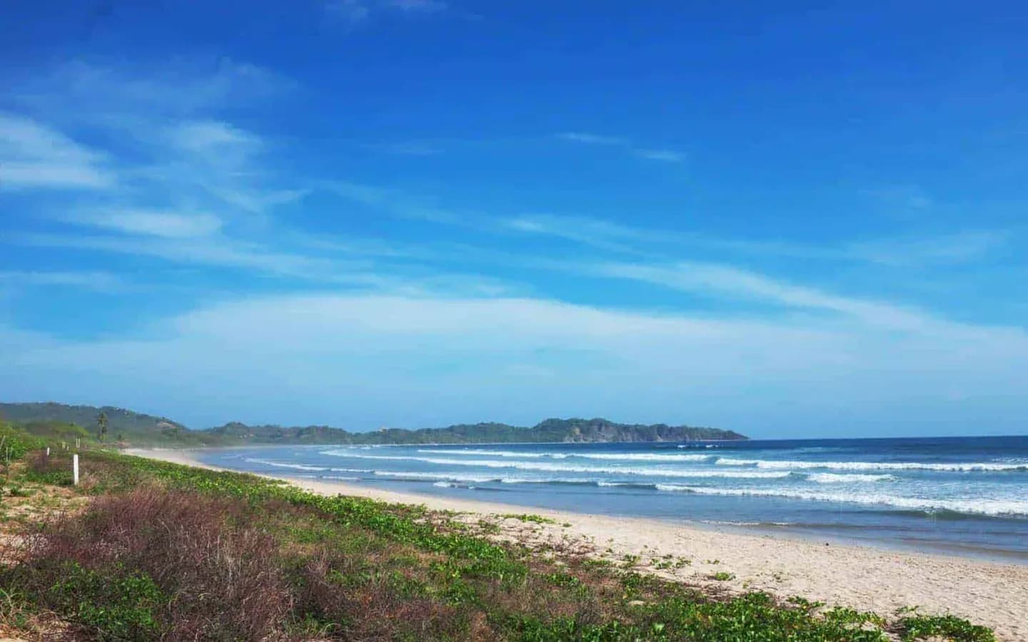 The wide sandy beach and surf at Nosara on Costa Rica's Nicoya Peninsula