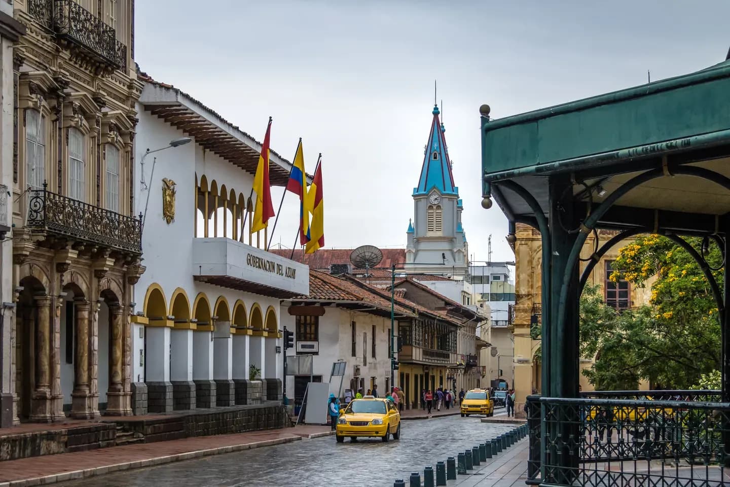 A colonial street near Parque Calderón with the blue spire of San Alfonso church, Cuenca, Ecuador