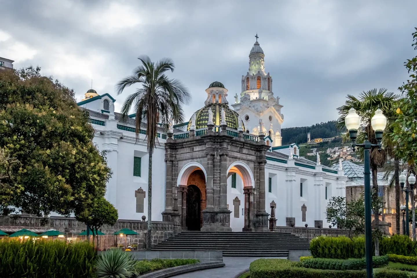 Palm trees and the white Metropolitan Cathedral on Plaza Grande in the old town of Quito, Ecuador