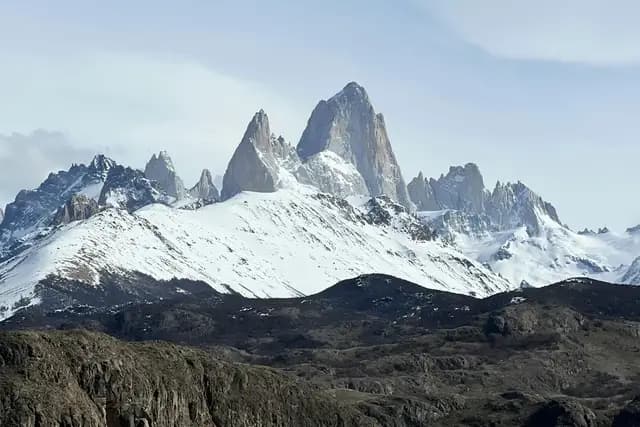The dramatic snow-capped granite peaks of Mount Fitz Roy in Argentine Patagonia under a clear blue sky