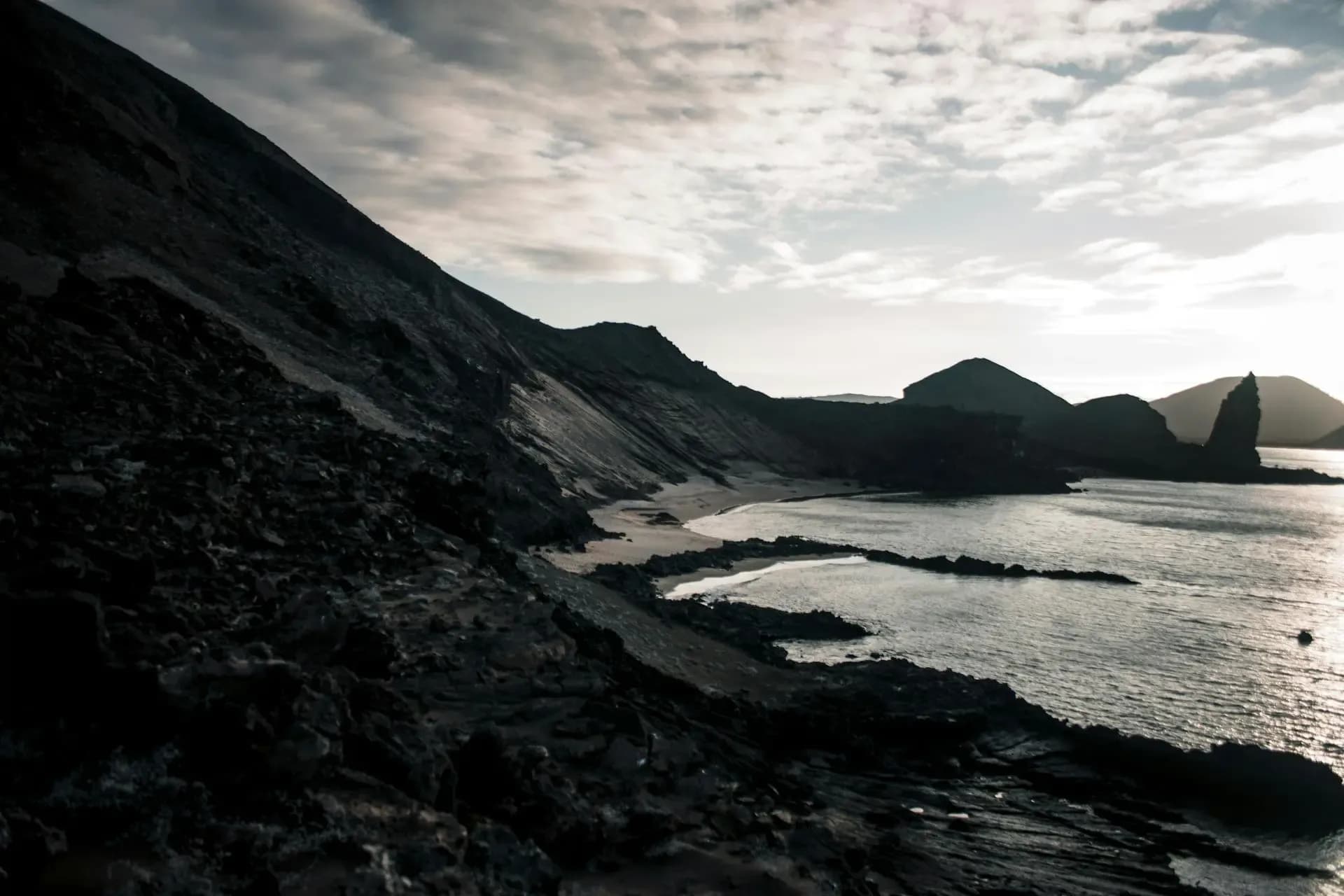Bartolome Island pinnacle and bay at sunset in the Galapagos Islands