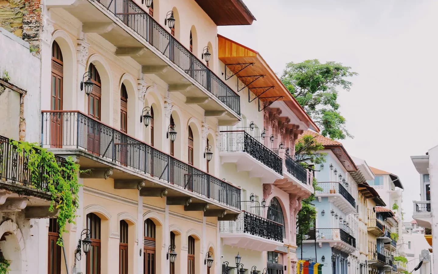 Pastel colonial facades and wrought-iron balconies on a street in Casco Viejo, Panama City
