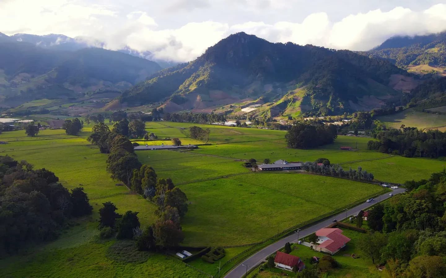Green farmland and forested peaks in the Chiriquí highlands at Cerro Punta, Panama