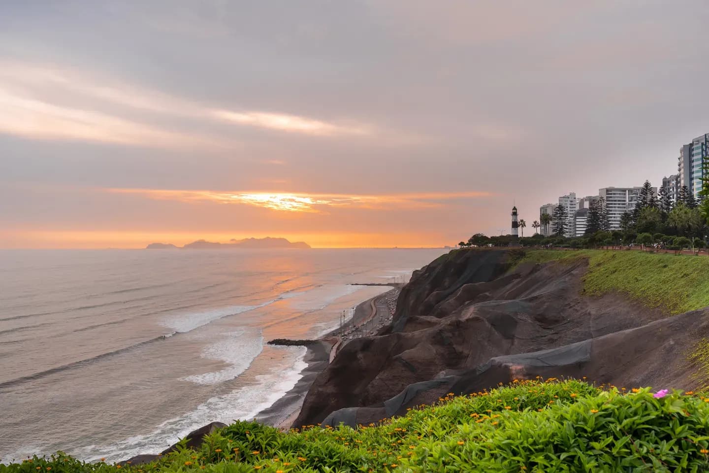 Sunset over the Pacific from the green cliffs of Miraflores, Lima, Peru