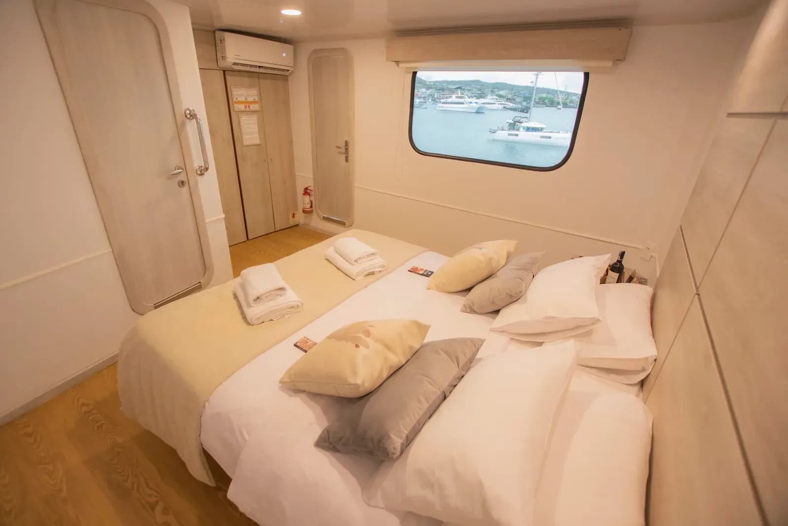 Matrimonial Suite cabin with double bed and harbour view aboard Seaman Journey, Galápagos