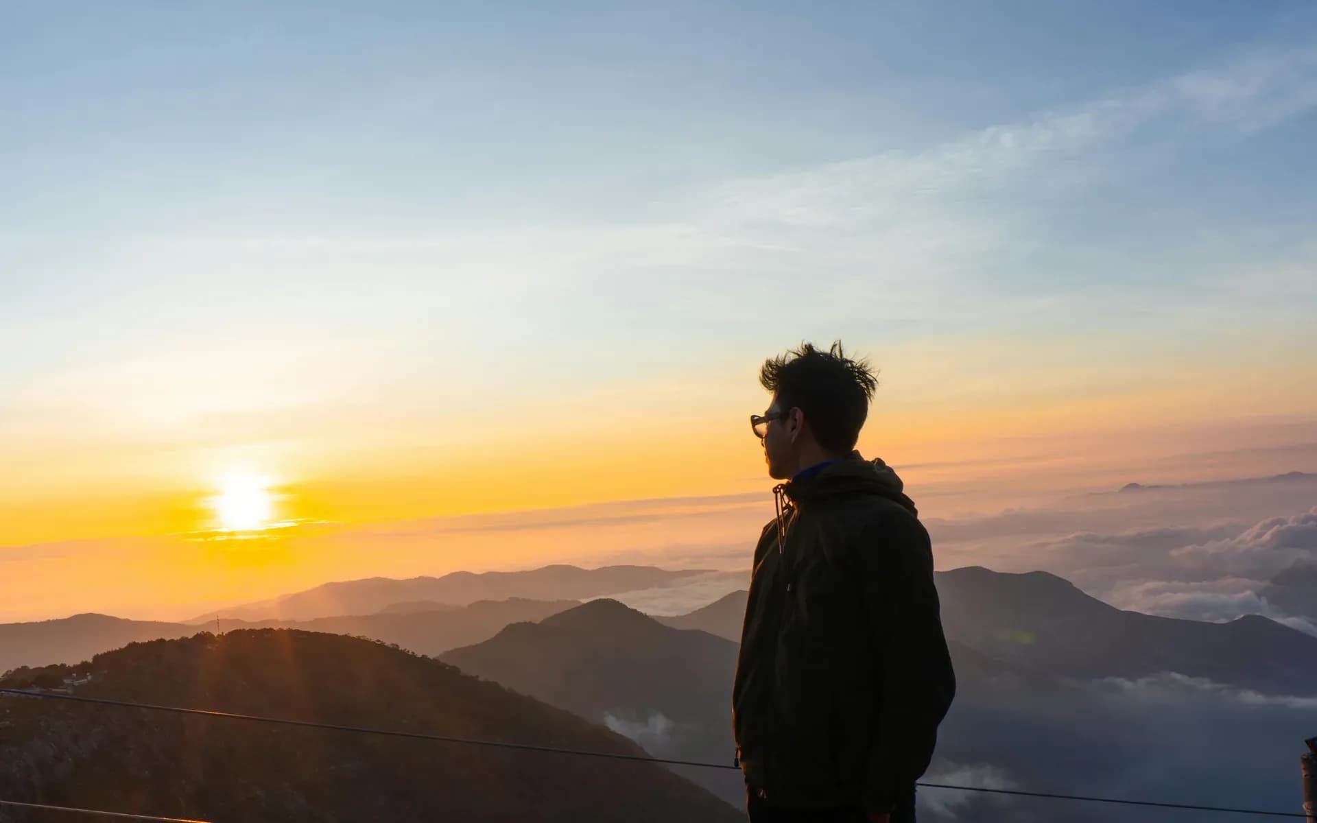 A lone traveller watching sunrise over the mountains of Mexico — a bespoke, tailor-made Latin America journey