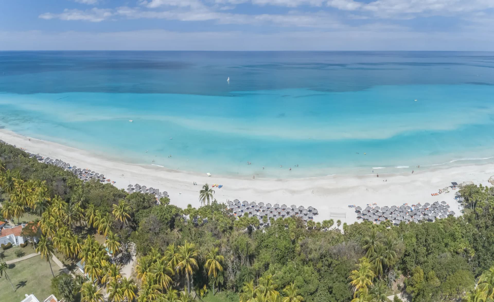 Empty palm-fringed white sand beach with turquoise Caribbean water at Varadero, Cuba