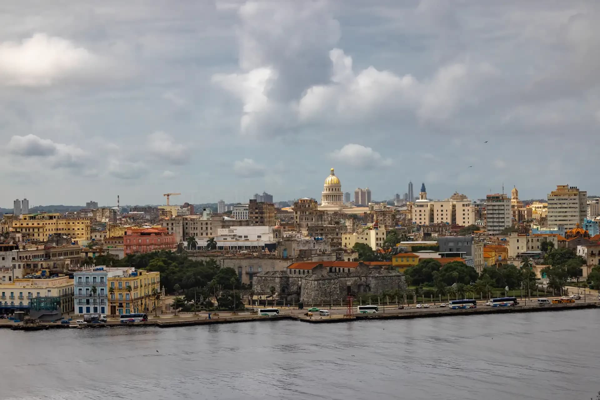 Panoramic view of the Havana skyline from across the harbour, showing the Capitolio dome and Malecón waterfront