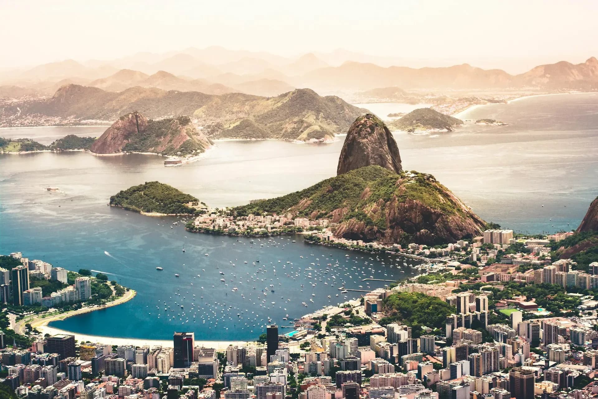 Sugarloaf Mountain rising above Botafogo Bay and the city of Rio de Janeiro, Brazil