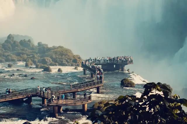 Iguazu Falls cascading through lush rainforest on the Brazil-Argentina border