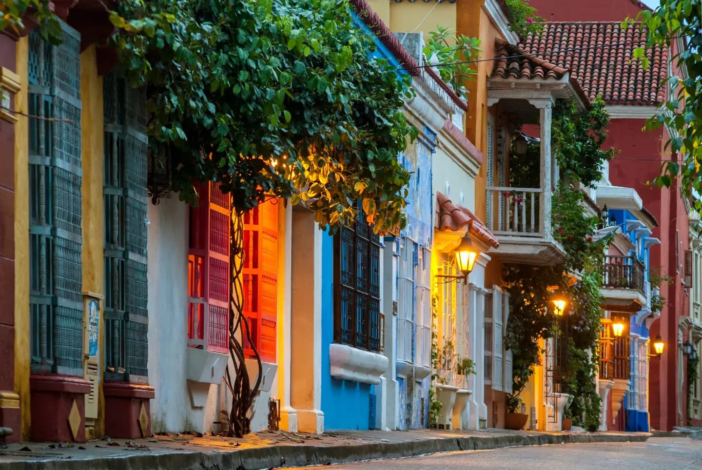 Colourful colonial houses with balconies and bougainvillea on a street in the old town of Cartagena, Colombia