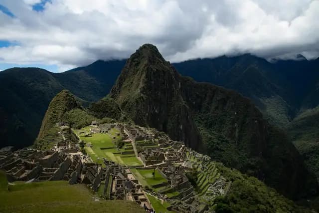 Machu Picchu citadel emerging from morning mist along the Inca Trail