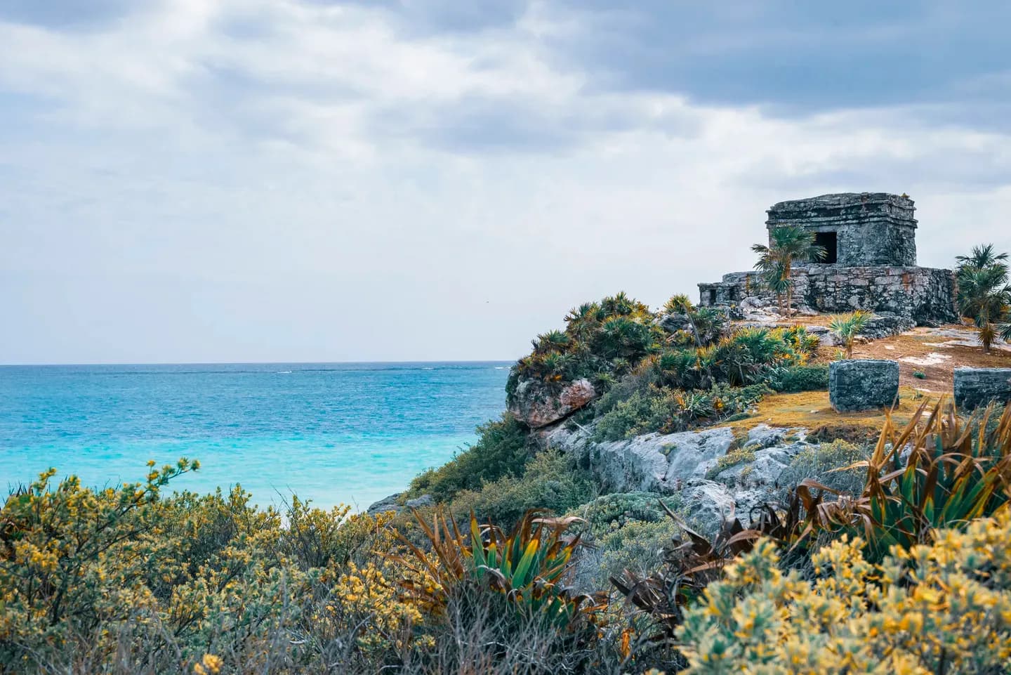 The Maya ruins of Tulum on a clifftop above the turquoise Caribbean Sea, Mexico